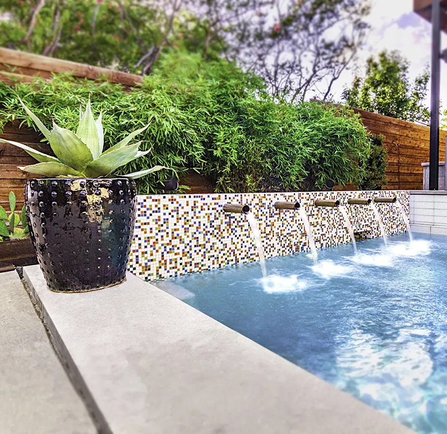 Closeup of water features in pool.